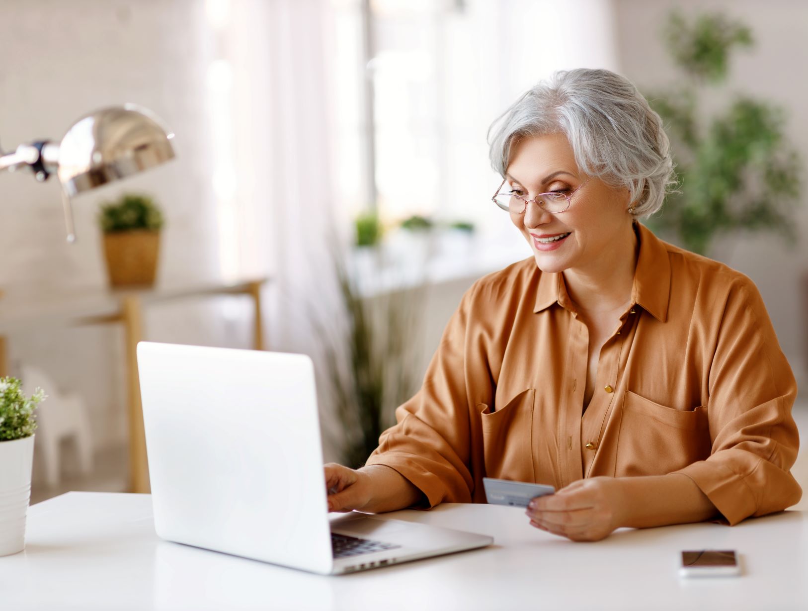 Senior Woman Happily Ordering Online