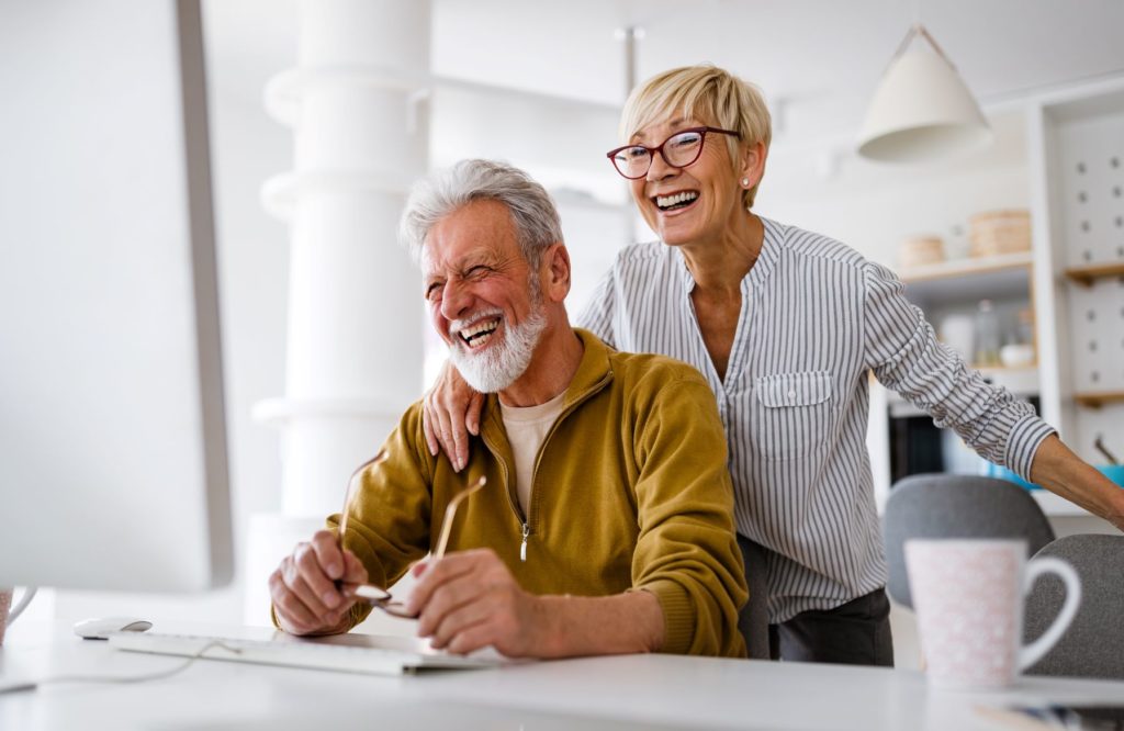 Senior Couple Happily Ordering Food Online Senior Couple Happily Ordering Food Online